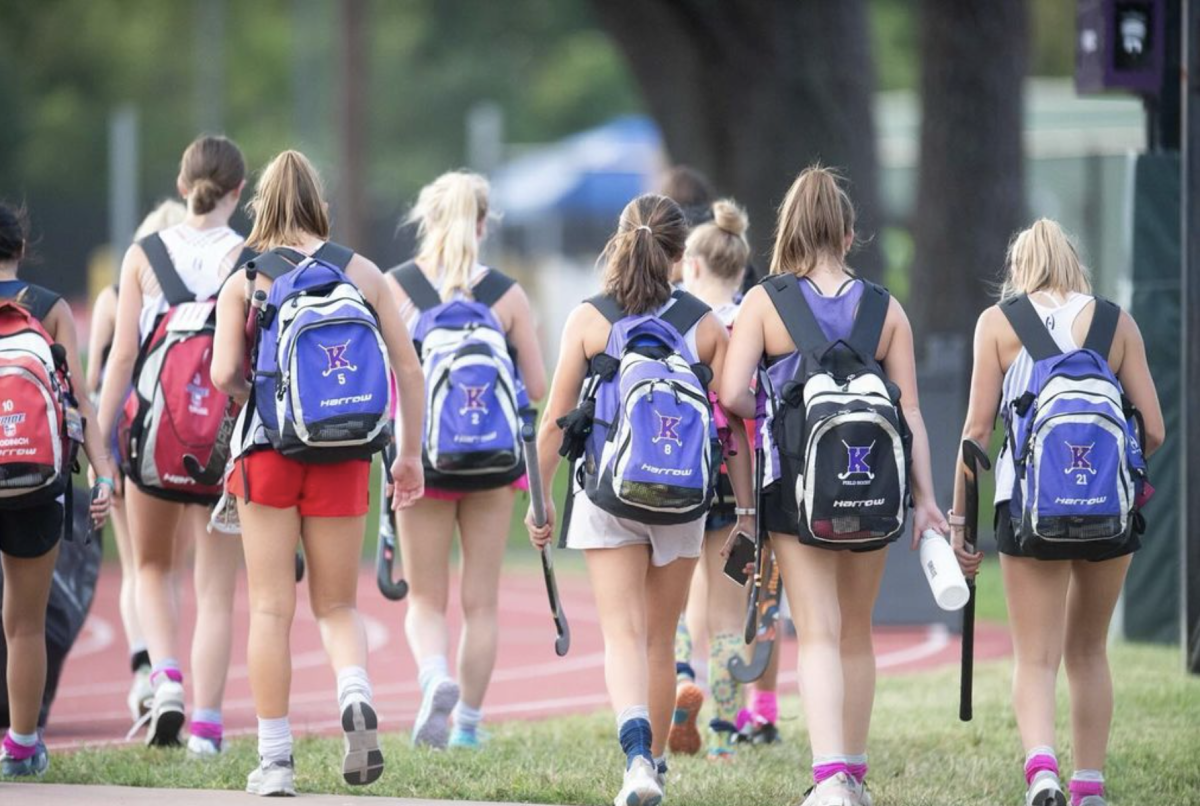 The field hockey team walks in unity. "I genuinely love field hockey. This sport and its community has given me so much. I’m just hoping to give back a little,” said Raynes